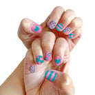 Hand with colorful nail art on a white background