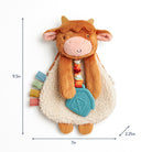 Plush toy cow with colorful elements and measurements on a white background