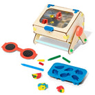 Children's educational toy set with wooden desk, colorful components, and a blue mold on a white background.