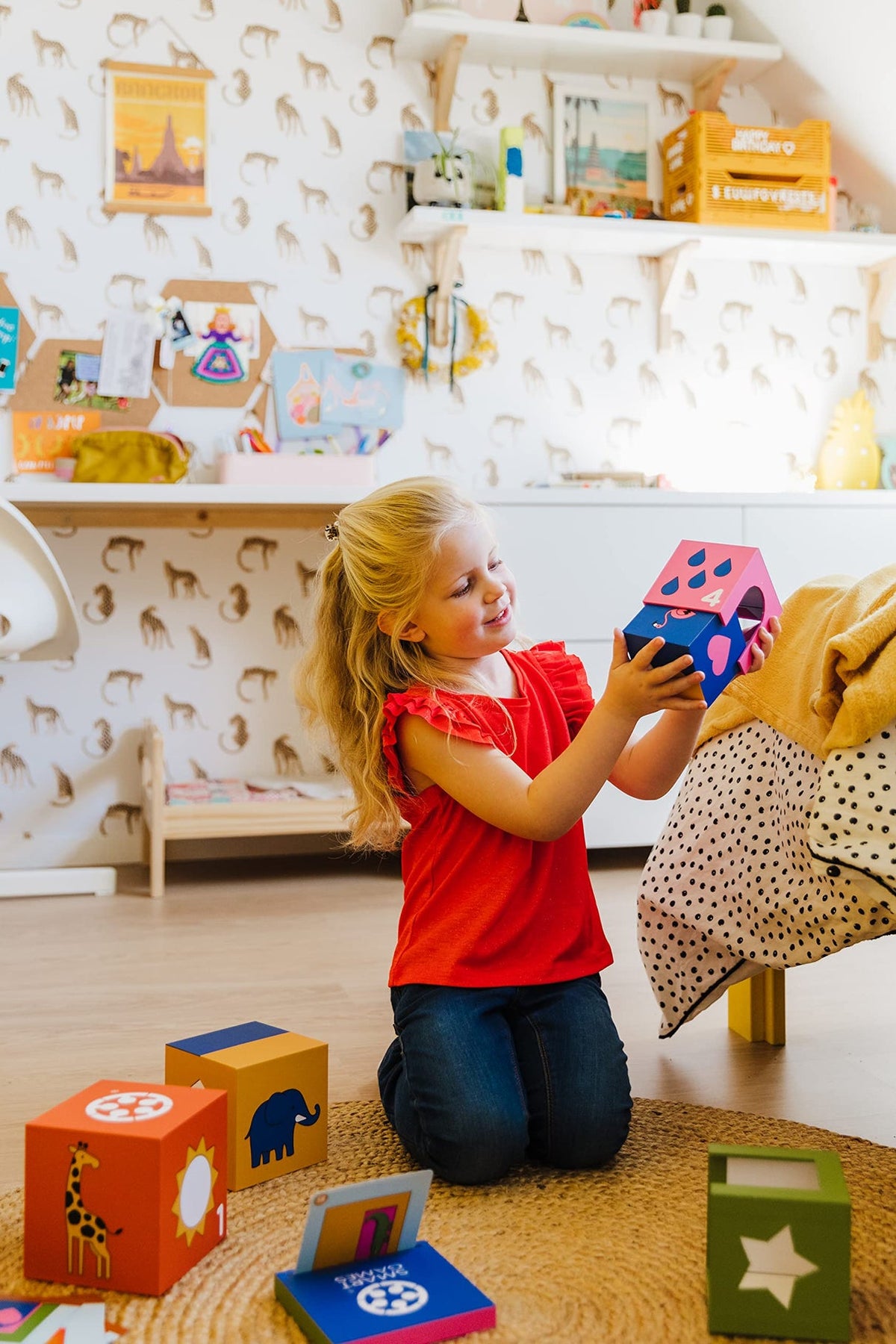 Child playing with colorful blocks in a playroom