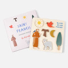 Wooden puzzle with Saint Francis design and packaging on a white background