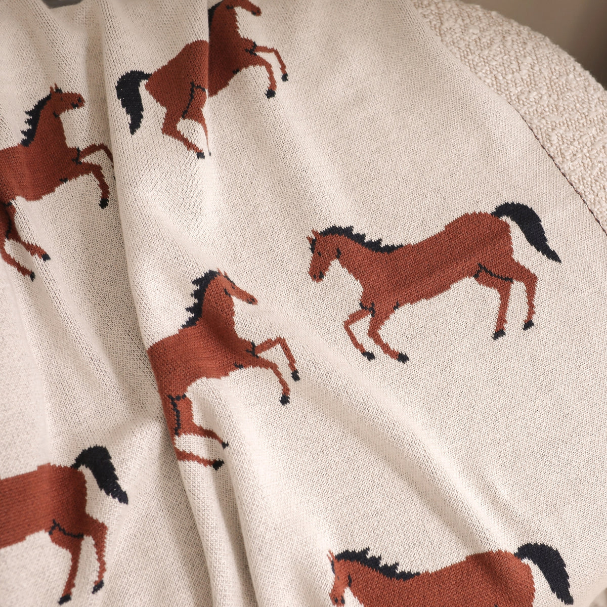 Close-up of fabric with horse pattern