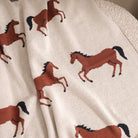 Close-up of fabric with horse pattern