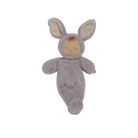 Plush toy baby in a bunny costume on a black background