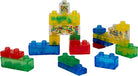 A collection of colorful, translucent Jelly Blox squishy building blocks assembled together, featuring standard bricks in red, blue, and green alongside special blocks filled with tiny colorful beads.