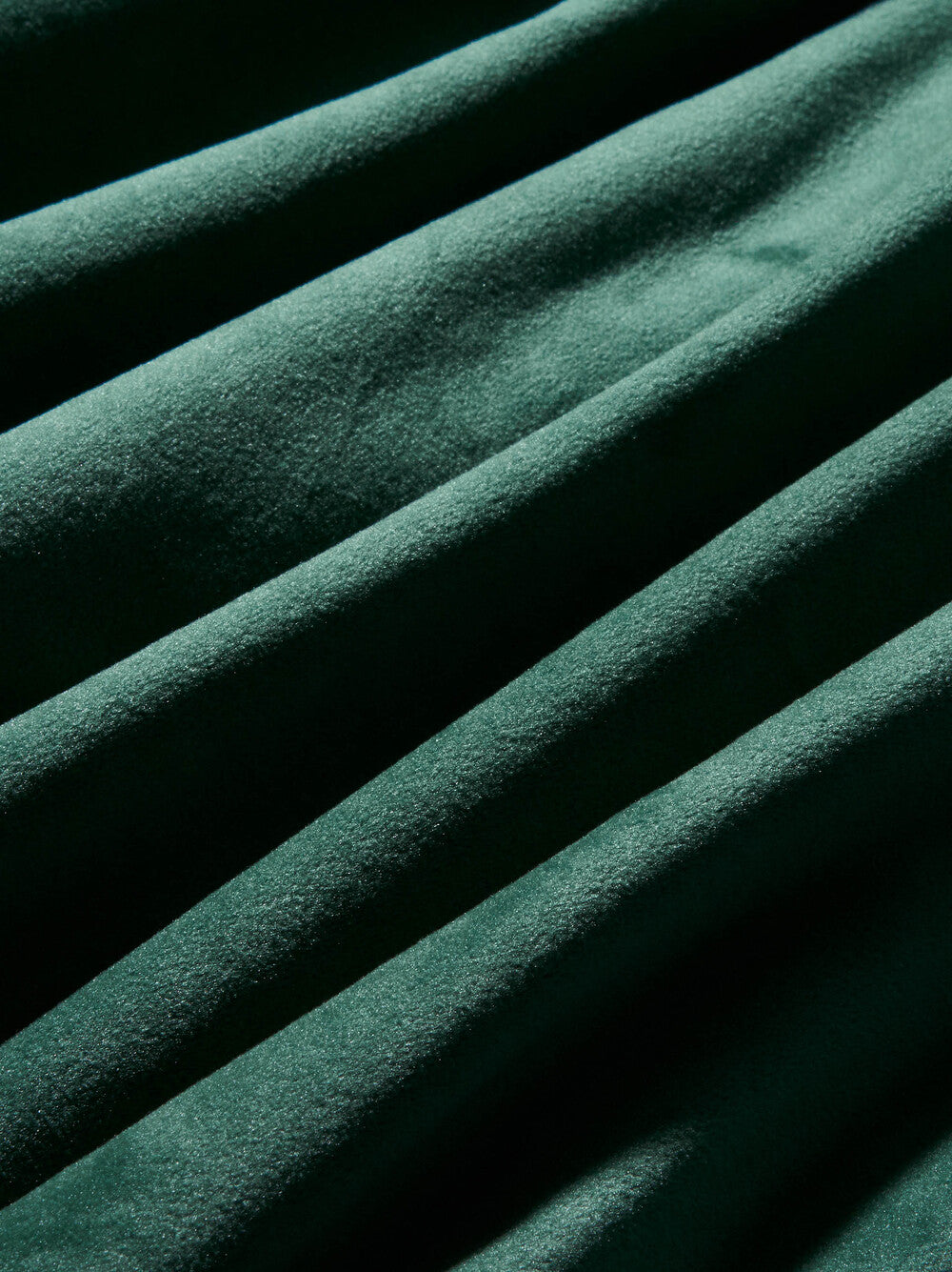 Close-up of green fabric with a textured surface