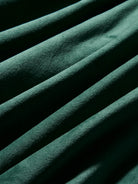 Close-up of green fabric with a textured surface