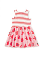 Pink dress with red floral patterns and a white background