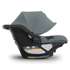 Gray and black baby car seat with canopy on a white background