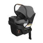 A Maxi-Cosi safety car seat in a dark gray and black colorway, featuring a matching canopy with a brown leatherette handle, shown on a solid white background.