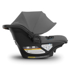 Gray baby car seat with canopy on a white background