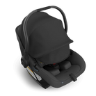 Black baby car seat with canopy on a white background