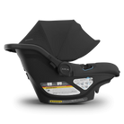 Black baby car seat with canopy on a white background