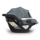 Baby car seat with gray canopy on a white background