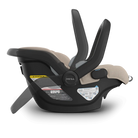 Black and beige baby car seat with 'MESA' branding on a white background