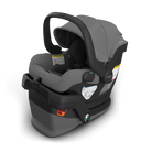 A HUPPAHOOY and MEXX baby car seat in a dark gray and black colorway, shown at a three-quarter angle on a clean white background.