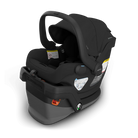 A black and dark gray infant car seat shown at a three-quarter angle on a clean white background. The brand names 'HUPPA' and 'MENOS' are visible on the product.