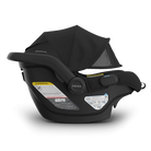 Black baby car seat with canopy on a white background