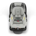 Gray baby car seat with black straps on a white background