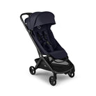 A stroller in dark navy blue fabric with a black frame and wheels, shown from a three-quarters angle on a solid white background.