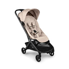 Beige baby stroller with black frame on a white background