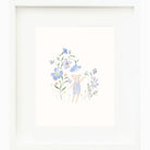 Framed artwork of a bear surrounded by blue flowers on a white background