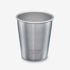 A stainless steel travel cup with a brushed metal finish, featuring the 'Kanso Steel Cup' logo near the base, set against a plain light gray background.