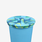Blue and green marbled cup with lid on a white background