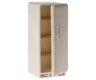 Beige refrigerator with a metallic handle on a white background