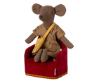 A Maileg mouse dressed in a plaid dress and yellow sash, sitting comfortably in a miniature red velvet armchair.