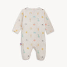 Baby onesie with colorful patterns on a white background