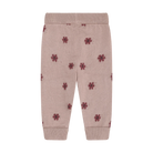 A pair of baby jogger pants in dusty pink, featuring a small dark red floral print and ribbed waistband, leg cuffs, and ankle cuffs.