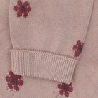 Close-up dusty pink, featuring a small dark red floral print