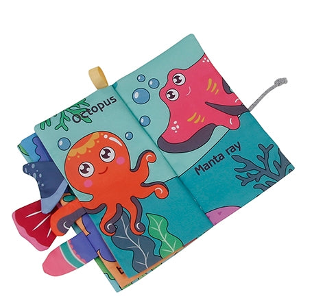 Children's soft book with ocean-themed illustrations on a white background