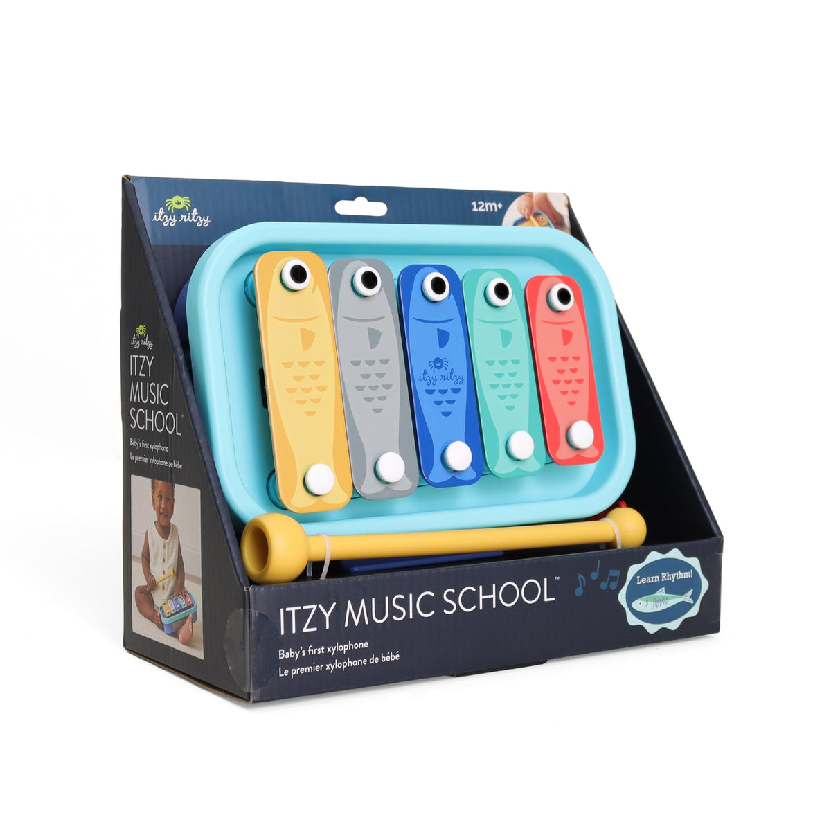 Itzy Music School toy set packaging with colorful instruments on a white background