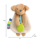 Plush dog toy with a green tag, measurement chart on the side