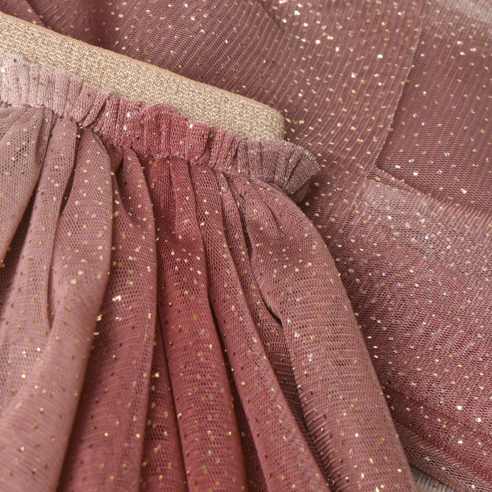 Close-up of Minymo Mesh Glitter Skirt in the color Huckleberry.
