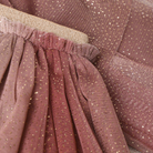 Close-up of Minymo Mesh Glitter Skirt in the color Huckleberry.