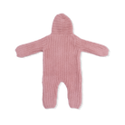 Pink knitted baby romper with a hood on a white background