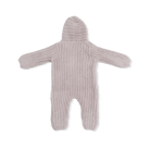 Knitted baby romper with a hood on a white background