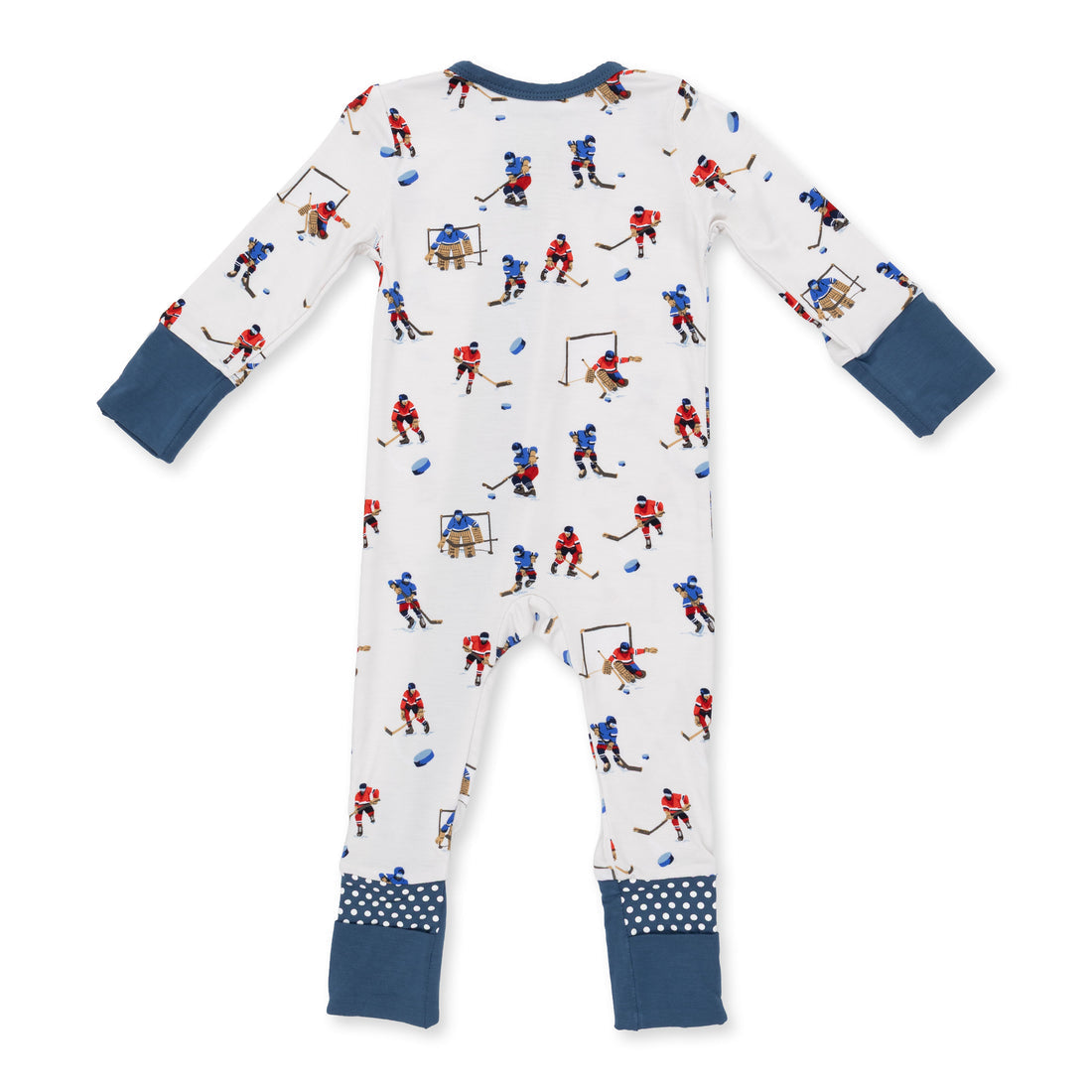 A baby long-sleeve footless one-piece pajama with an all-over hockey player print on a white background, featuring navy blue cuffs and patterned ankle cuffs.