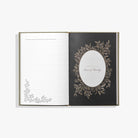Open book with decorative pages on a white background
