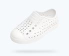 White sneaker with small holes on a white background