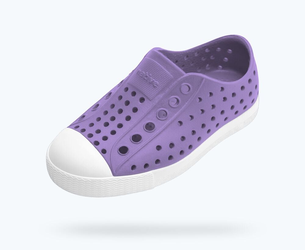 Purple slip-on shoe with white sole on a white background