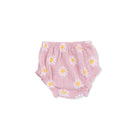 Pink baby bloomers with daisy pattern on a white background