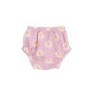 Pink baby bloomers with daisy pattern on a white background