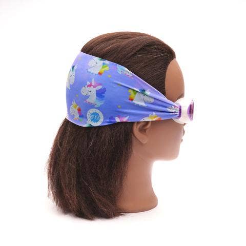Mannequin head wearing a colorful headband with unicorn designs on a white background