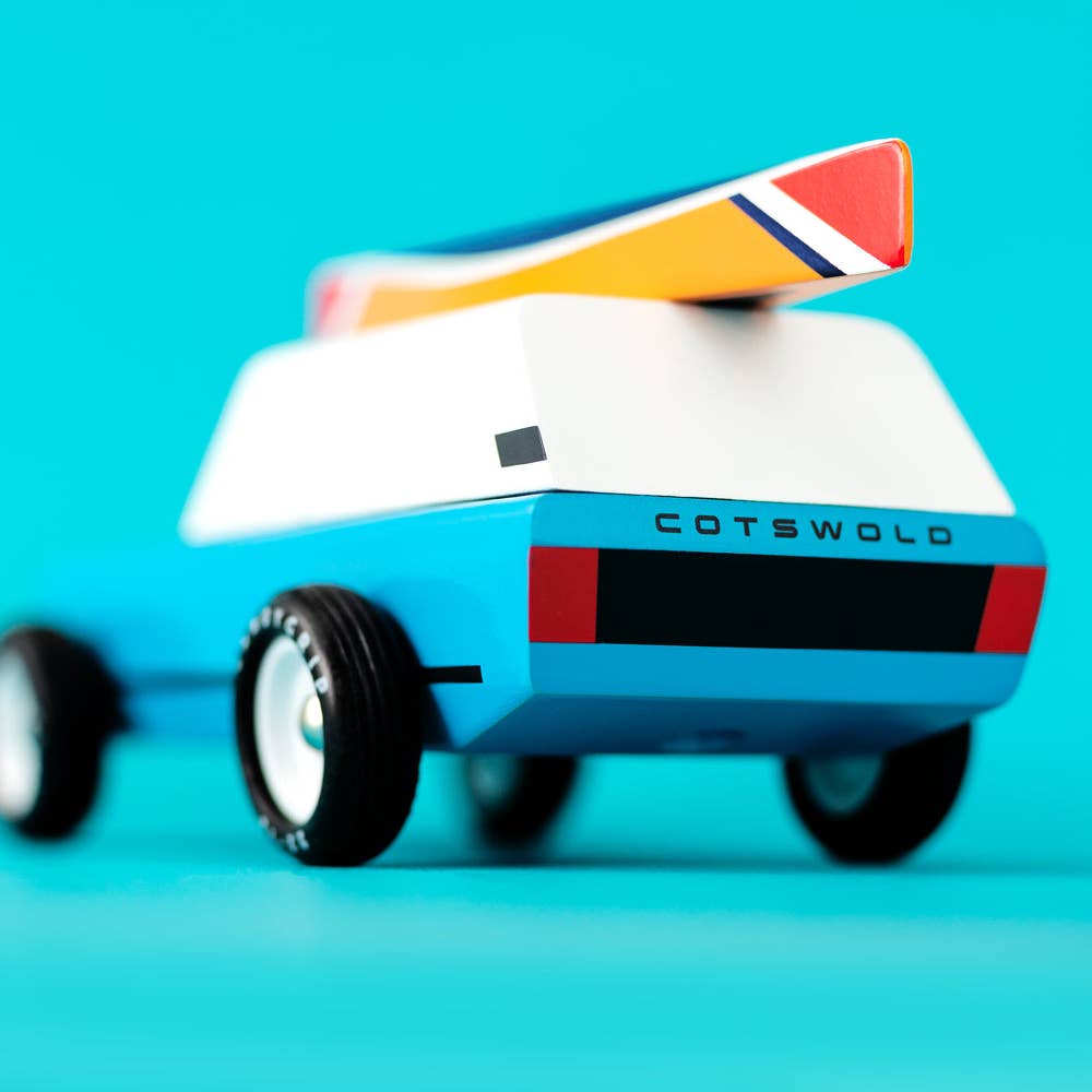 Toy car with a British flag on a blue background