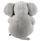 A light gray plush elephant toy shown from the back, featuring soft, textured fur and a small blue brand tag near the tail, set against a plain white background.