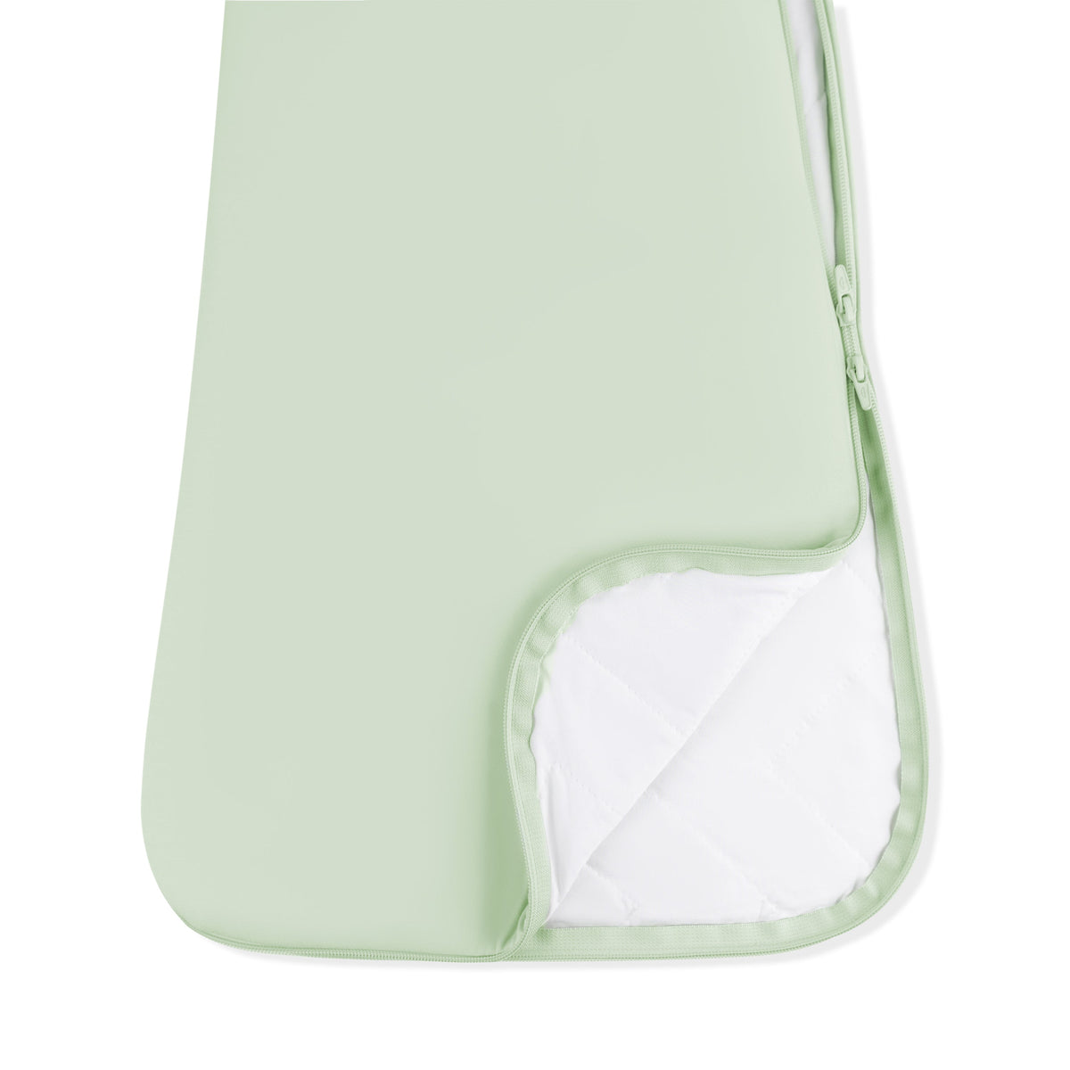 Light green baby changing pad with a white interior on a white background
